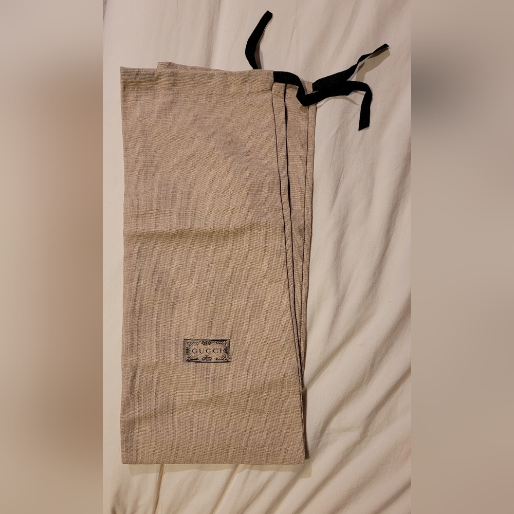 Two Gucci dust bags
